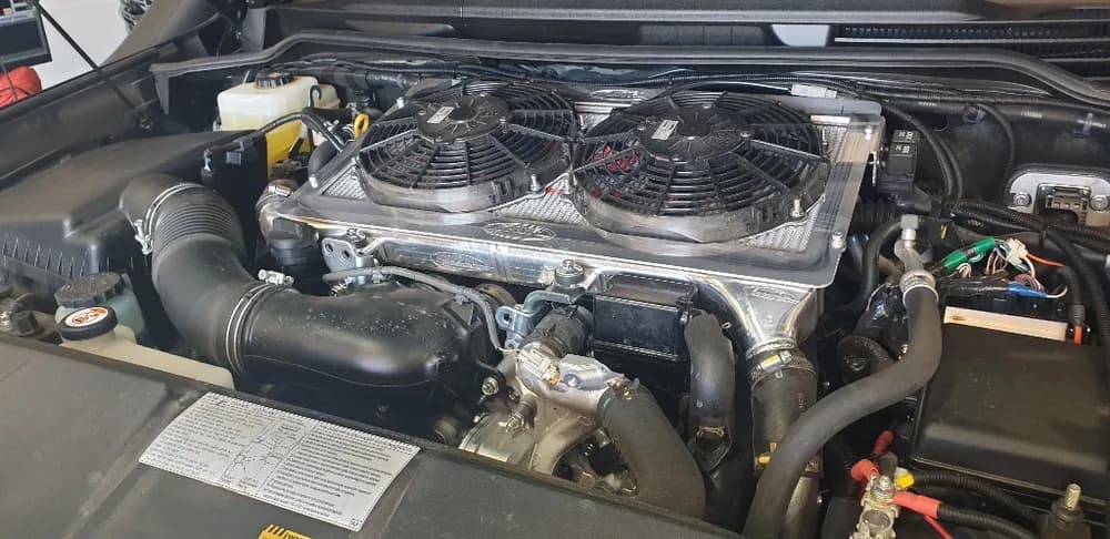 Modified diesel engine bay with twin-fan intercooler during a build at Trusted Mechanical, Adelaide