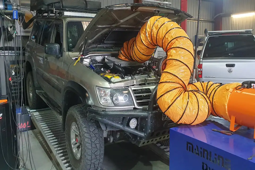 Nissan on the hoist for servicing at Trusted Mechanical, Lonsdale